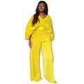 Bright yellow velvet jumpsuit with pleated wide sleeves and matching high-waisted pants in a purple satin style