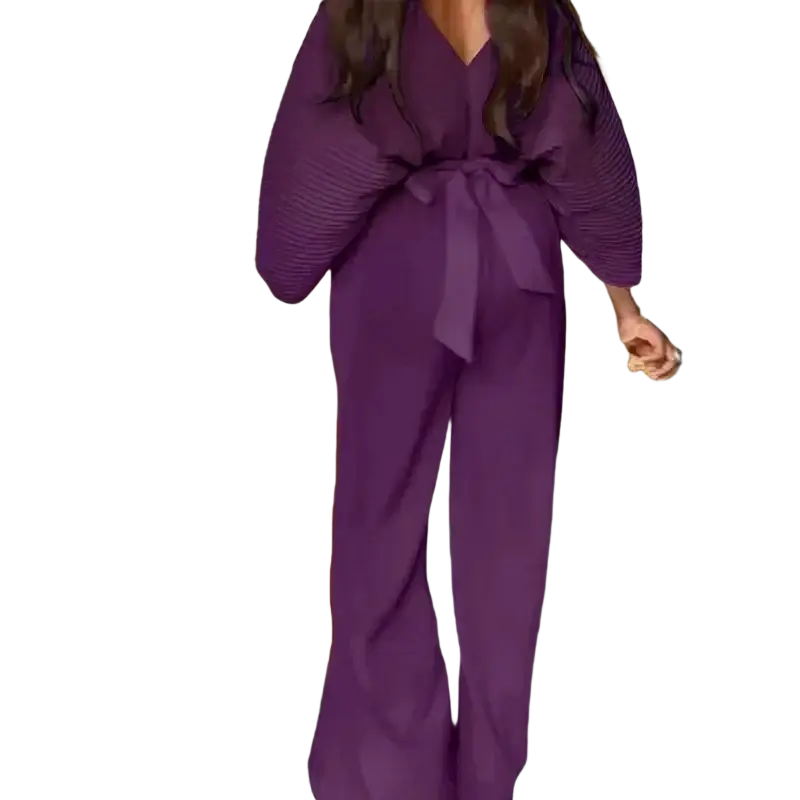 A flowing purple satin jumpsuit with pleated voluminous sleeves and a matching belt tied at the waist