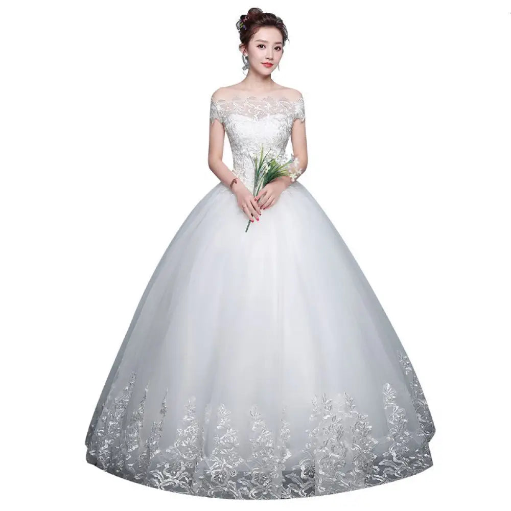 White qidi lace off the shoulder wedding dress with lace detailing and flowing tulle ball gown skirt