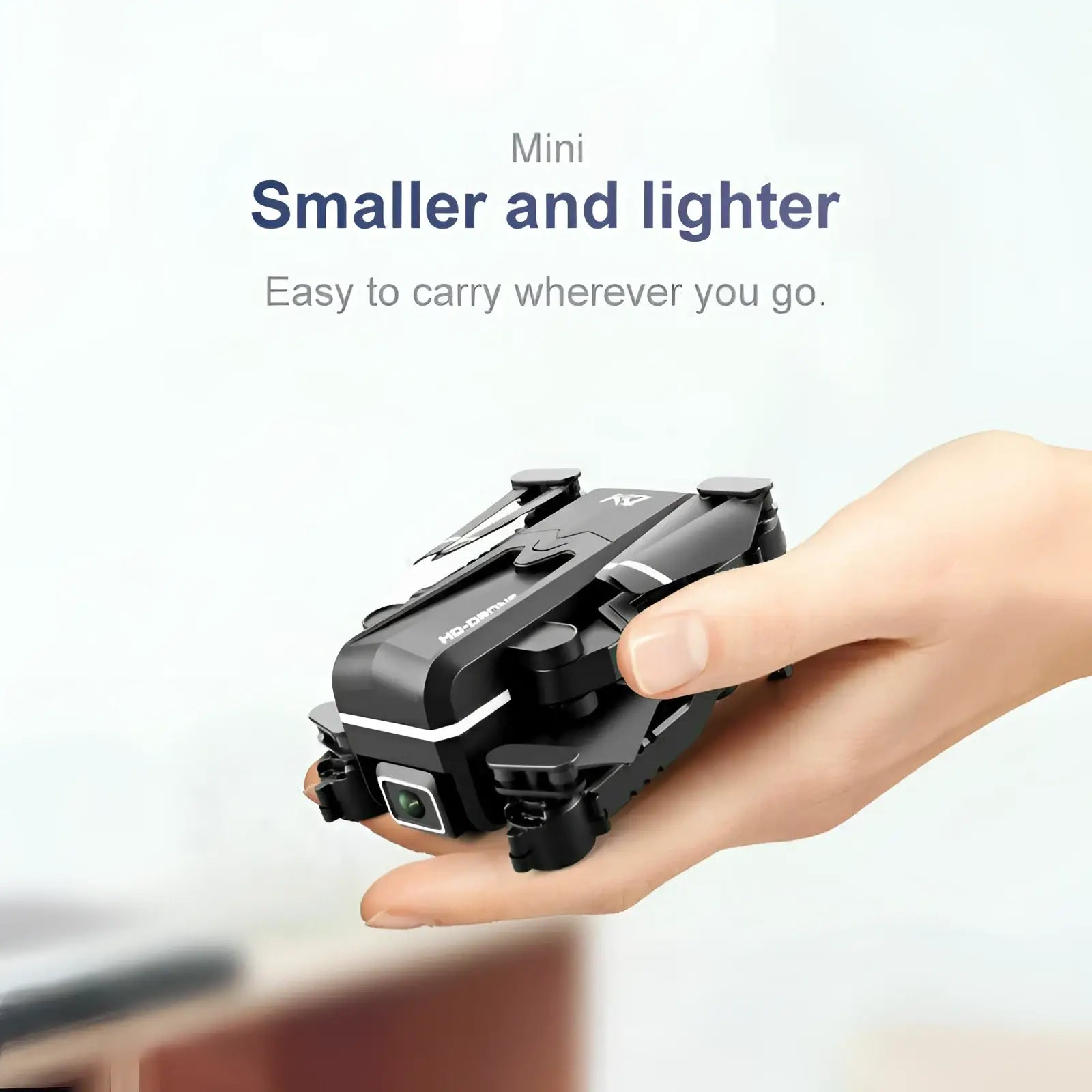 Black compact foldable quad air drone with sleek design and subtle white accents featuring 4k hd dual cameras