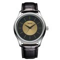 Quartz leather men’s dress watch with black leather strap silver-toned case and black dial with gold sunburst detailing