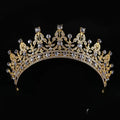Ornate crystal queen bridal tiara in gold with intricate floral patterns and clear sparkling crystals