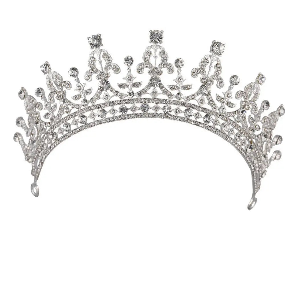 Silver ornate crystal queen bridal tiara with intricate floral designs and sparkling clear crystals in gold and silver