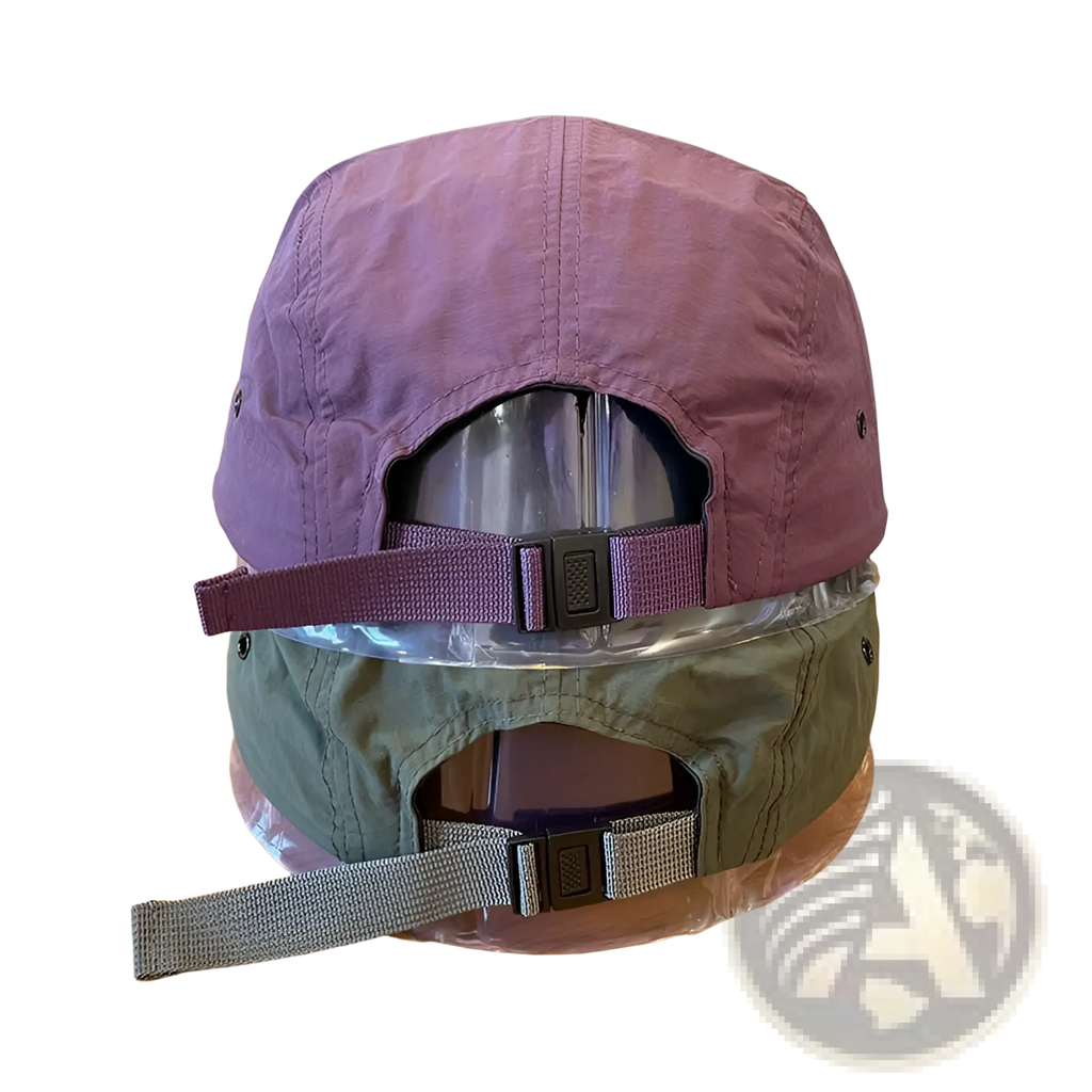 Purple quick drying five panel cap with adjustable strap and black plastic buckle shown from the back side