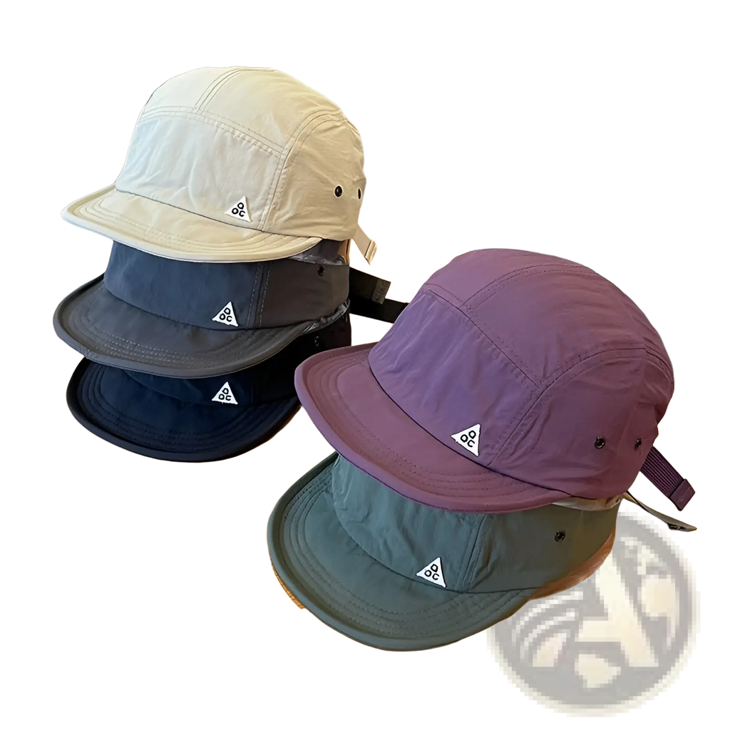 Quick drying short brim five panel hats in beige dark gray navy blue and purple with a white triangular logo