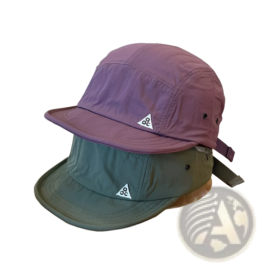Purple and olive green quick drying five panel cap with white triangular logos and short brim for outdoor use