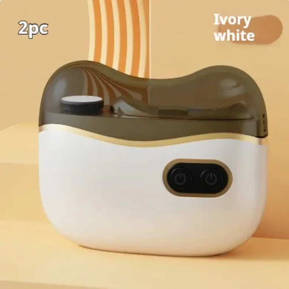 Ivory white and translucent brown dual-chamber rechargeable electric nail clipper and trimmer with gold trim