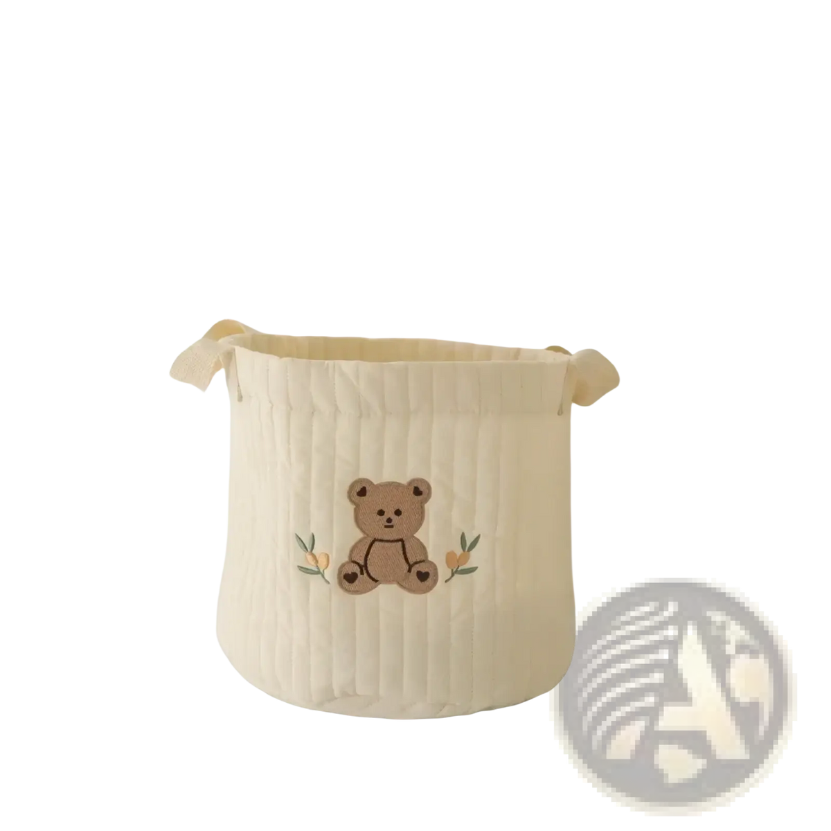 Cream-colored quilted fabric baby diaper storage basket organizer with embroidered brown teddy bear and green leaves