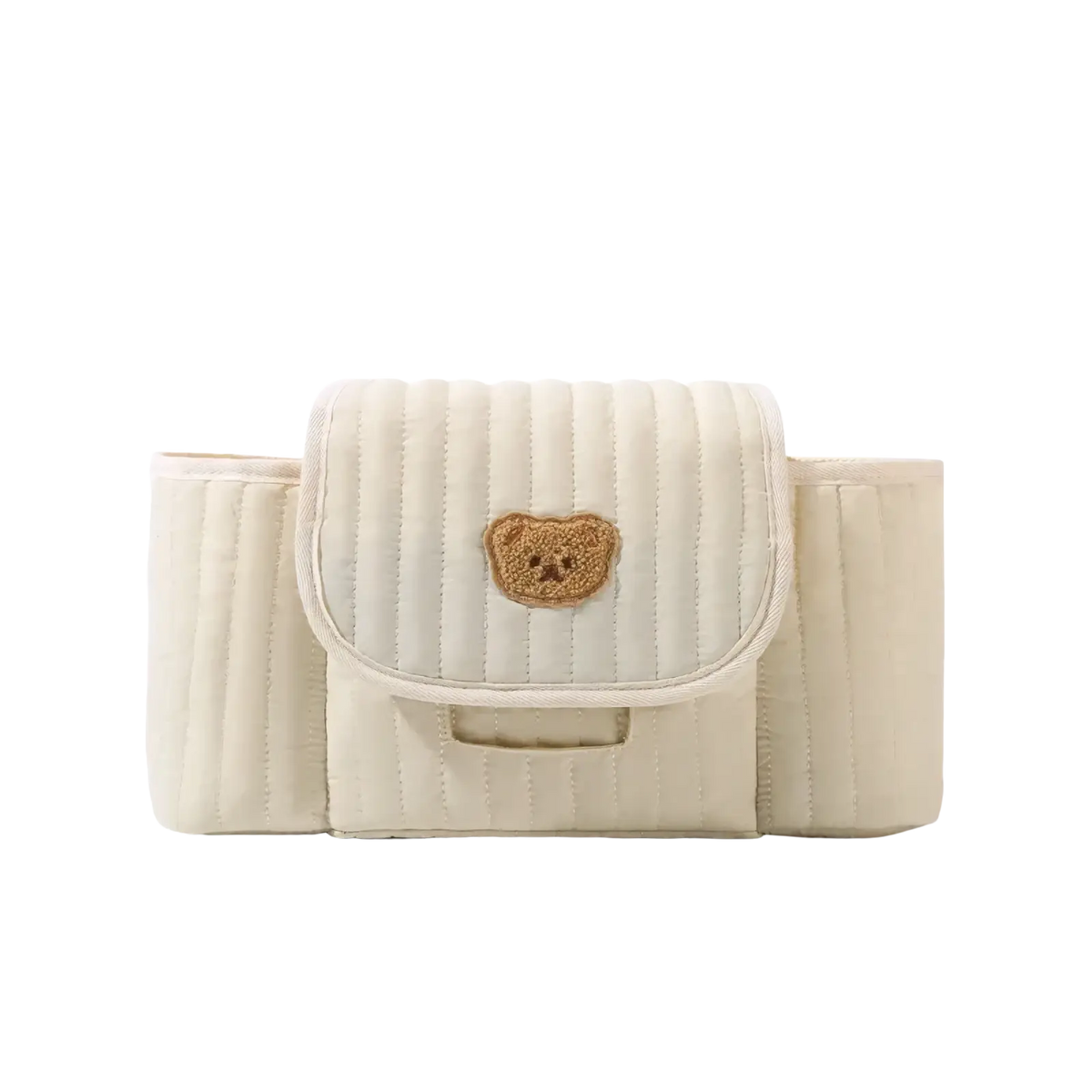 Cream-colored quilted baby carrier with tan embroidered bear face on front flap for stroller organization