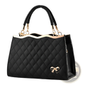 Black quilted crossbody handbag with gold hardware and decorative bow detailing in a smooth leather finish