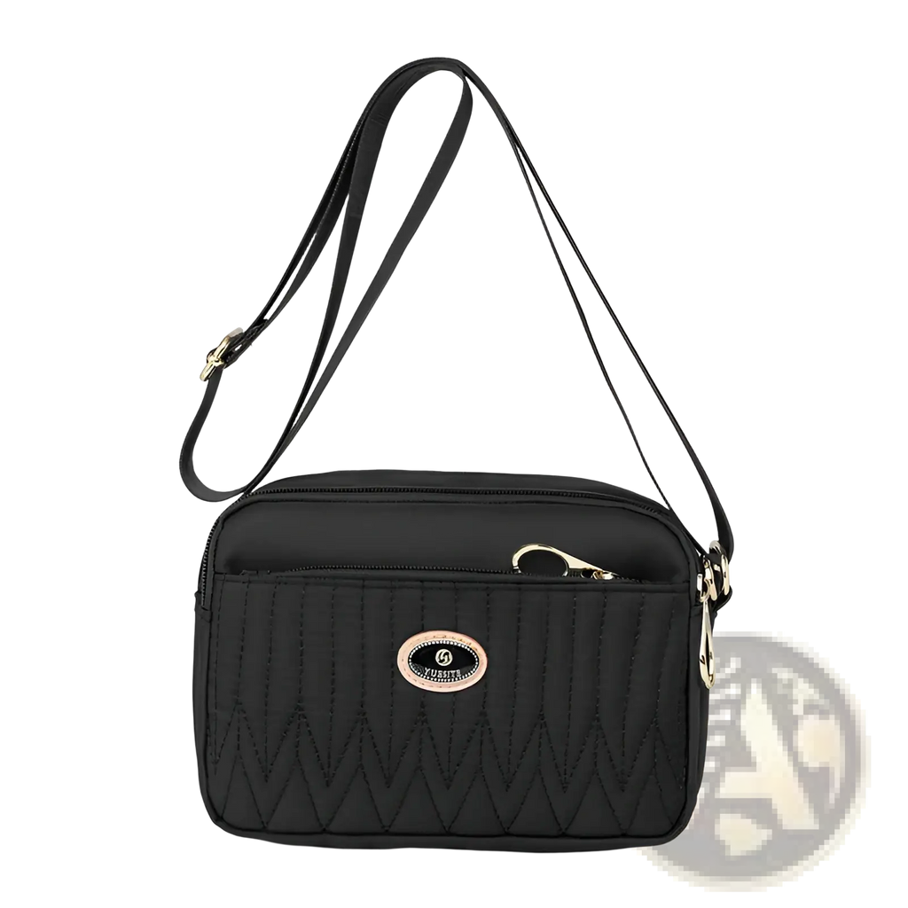 Black quilted crossbody bag with gold hardware and central oval logo plaque for stylish everyday use