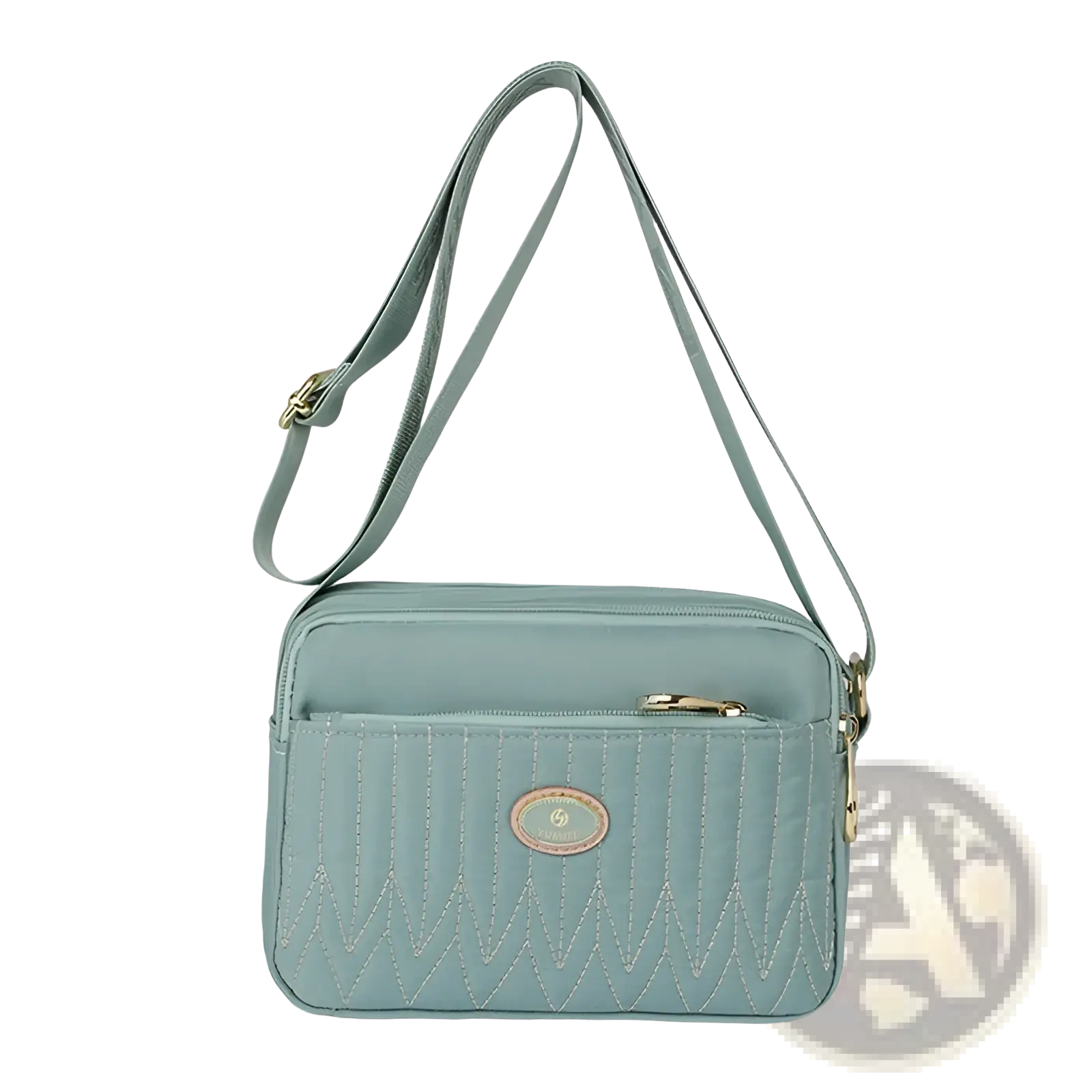 A light teal quilted crossbody bag with gold hardware, adjustable strap, and gold-tone zippers