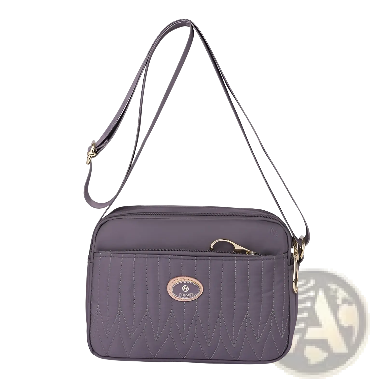 Gray quilted crossbody bag with gold-tone hardware and circular brand emblem on front, featuring adjustable strap
