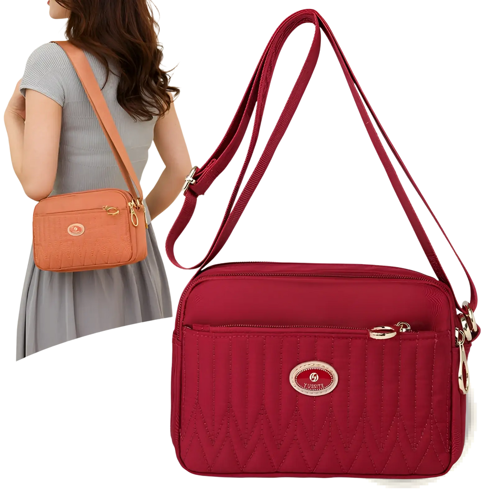 Red quilted crossbody bag with gold-tone hardware and circular logo plaque on front for stylish hands-free use
