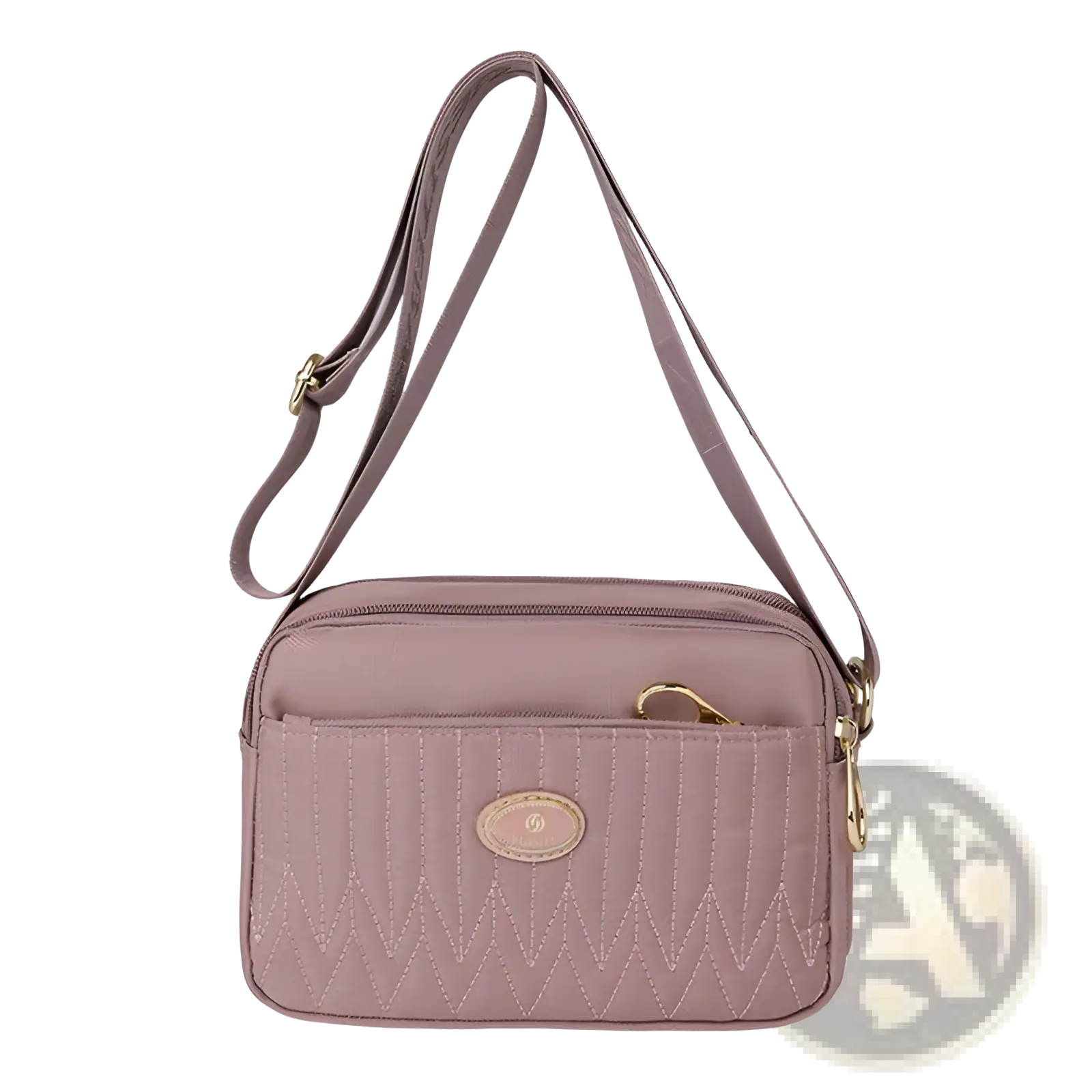 A mauve quilted crossbody bag with gold hardware and zigzag stitch detailing for stylish everyday use