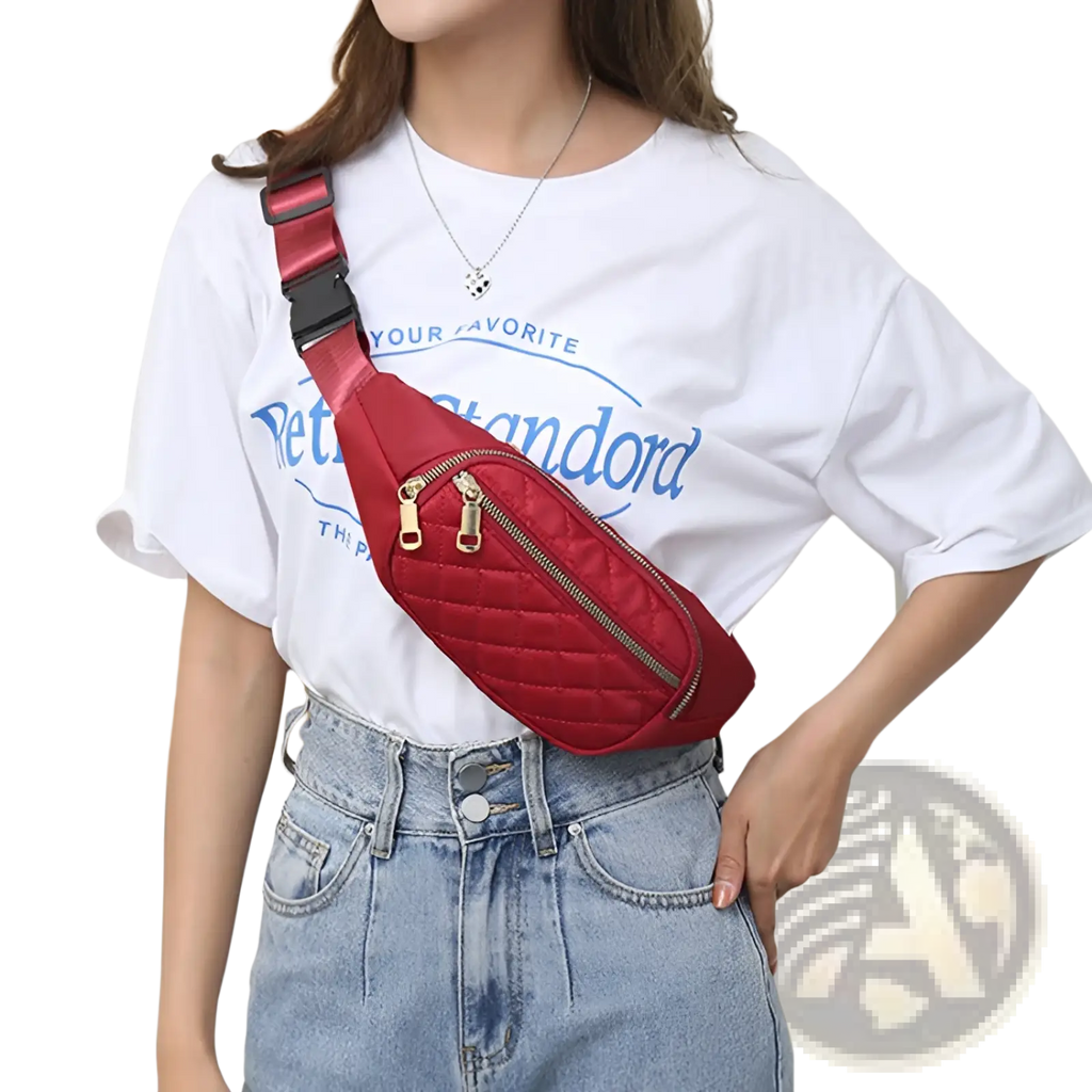 Red quilted crossbody fanny pack for women with gold-tone zippers and black adjustable strap for sports use