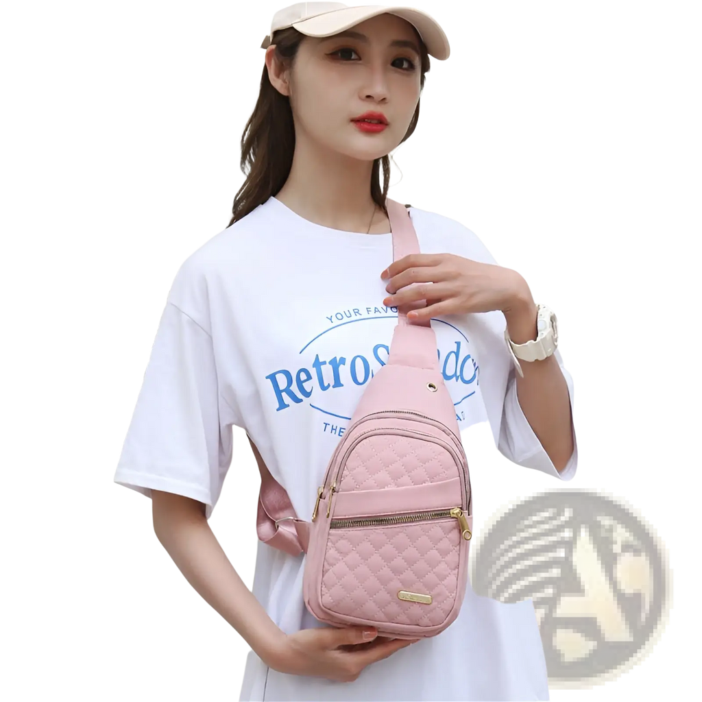 Pink quilted crossbody slanted chest bag for women with gold-tone zipper and hardware in leather material