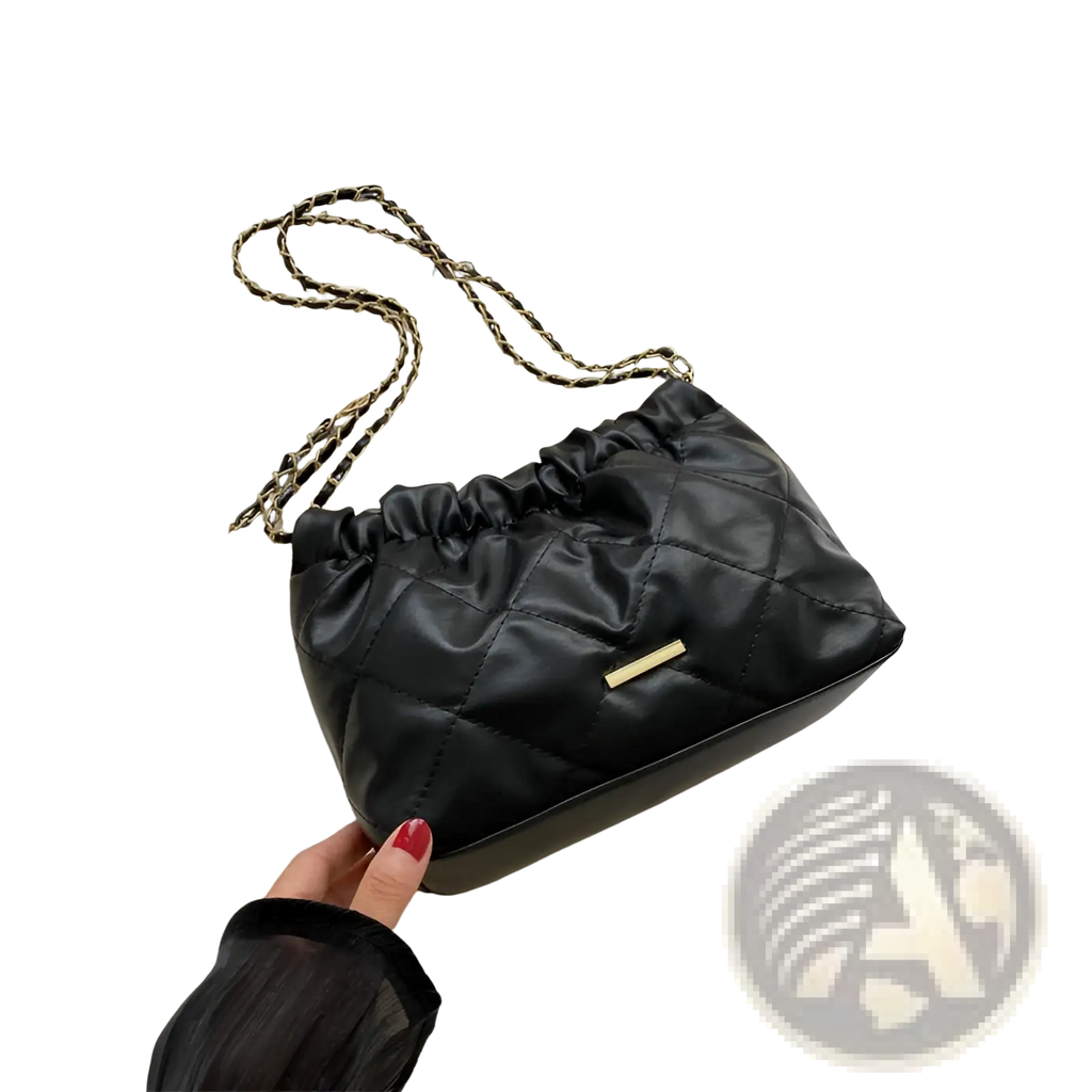 Black quilted faux leather crossbody bag with gold-tone chain strap and small metallic clasp for stylish use