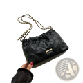 Black quilted faux leather crossbody bag with gold-tone chain strap and small metallic clasp for stylish use