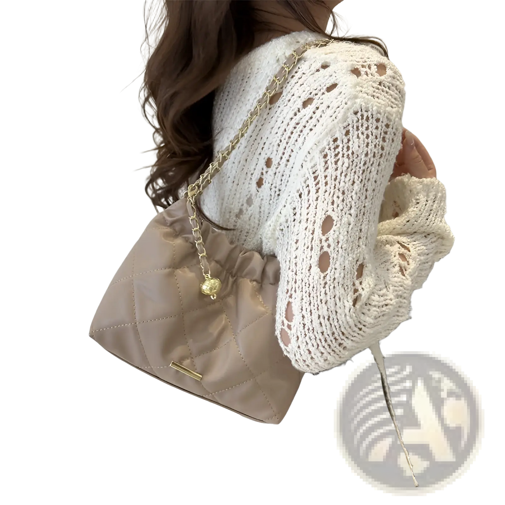 Beige quilted faux leather crossbody bag with gold-tone chain strap and small golden charm for elegant use