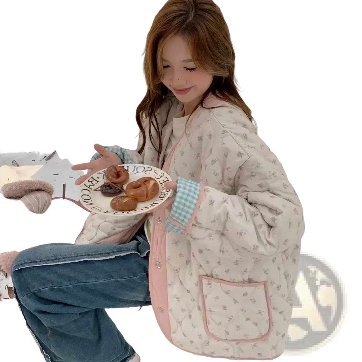 A cozy cream-colored quilted floral cotton winter jacket with pink trim and checkered cuffs for cold weather