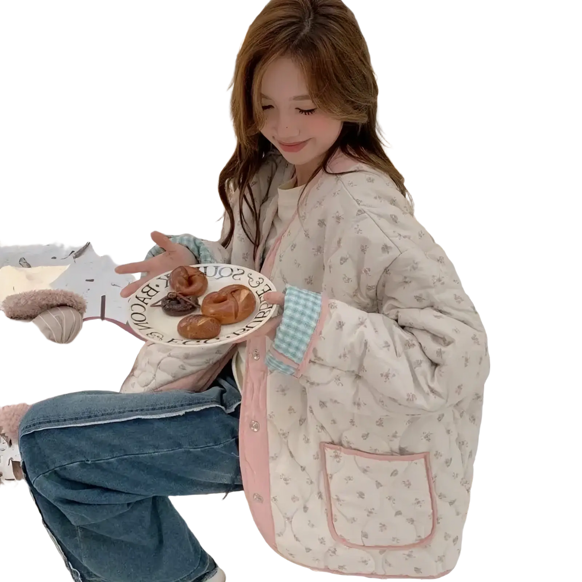 A cozy cream-colored quilted floral cotton winter jacket with pink trim and checkered cuffs for cold weather