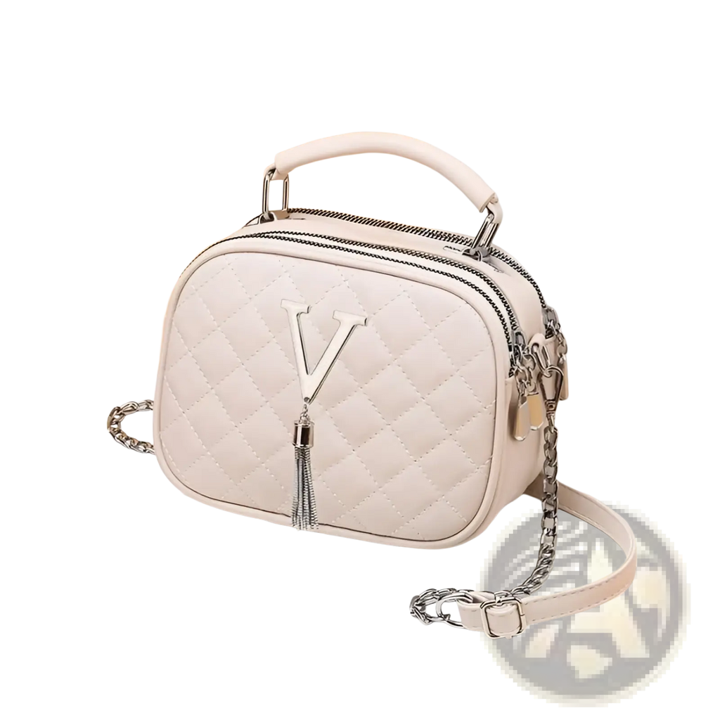 A white quilted handbag with silver v logo tassel chain strap and top handle featuring silver hardware
