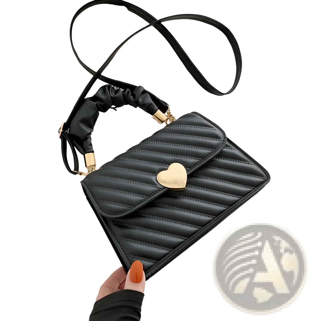 Black quilted crossbody bag with a gold heart clasp and ruched black handle for stylish everyday use