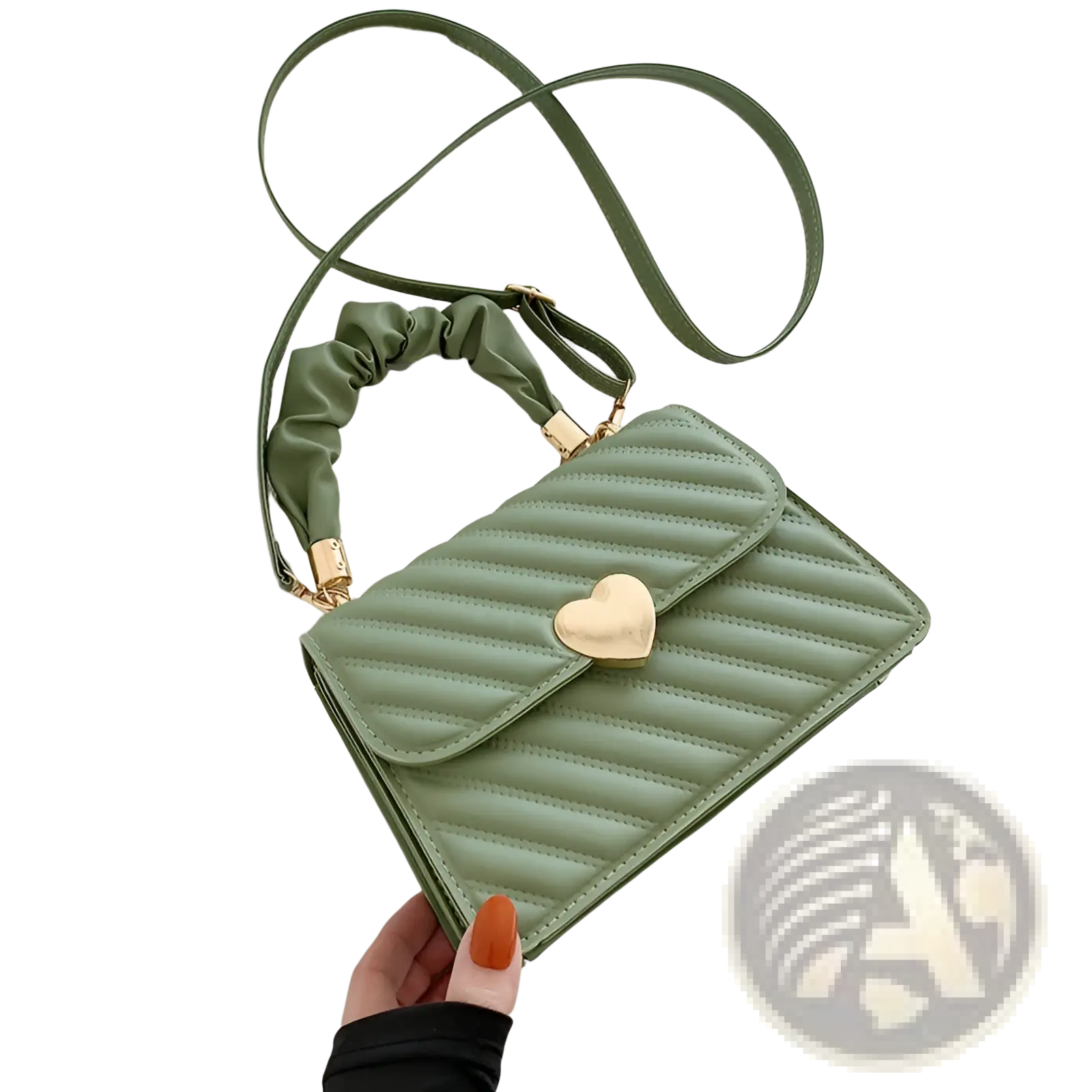 A mint green quilted crossbody bag with a gold heart clasp and matching ruched strap for stylish use