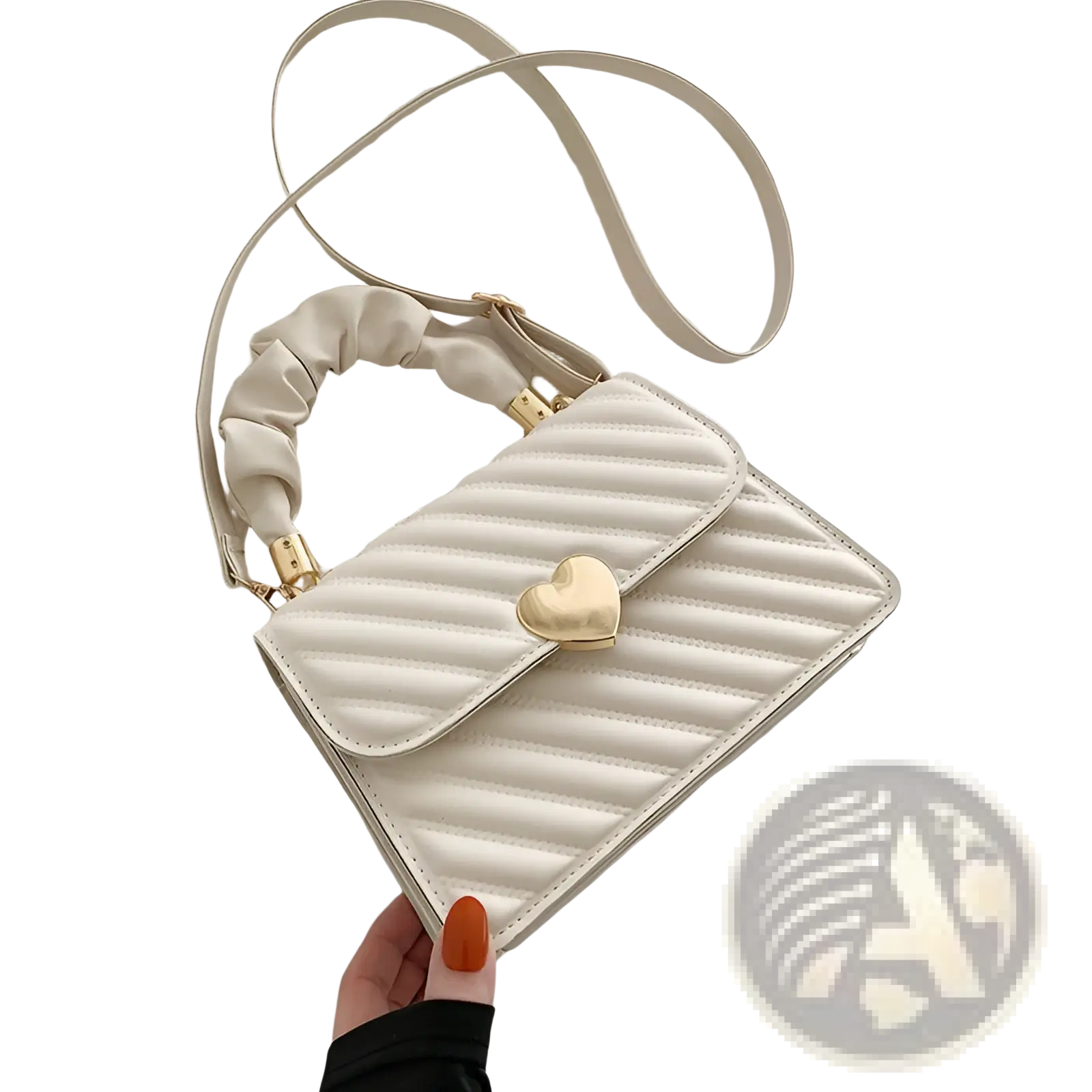 A cream-colored quilted crossbody bag with a gold heart-shaped clasp and matching ruched handle
