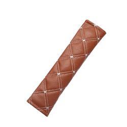 Brown quilted leather car seat belt pad with white stitching for comfortable vehicle safety belt use