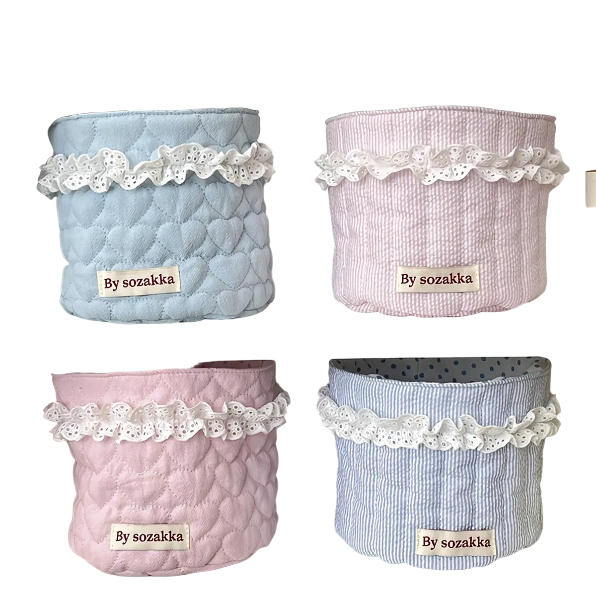 Pastel-colored quilted nursery storage baskets with delicate white lace trim and heart-patterned stitching