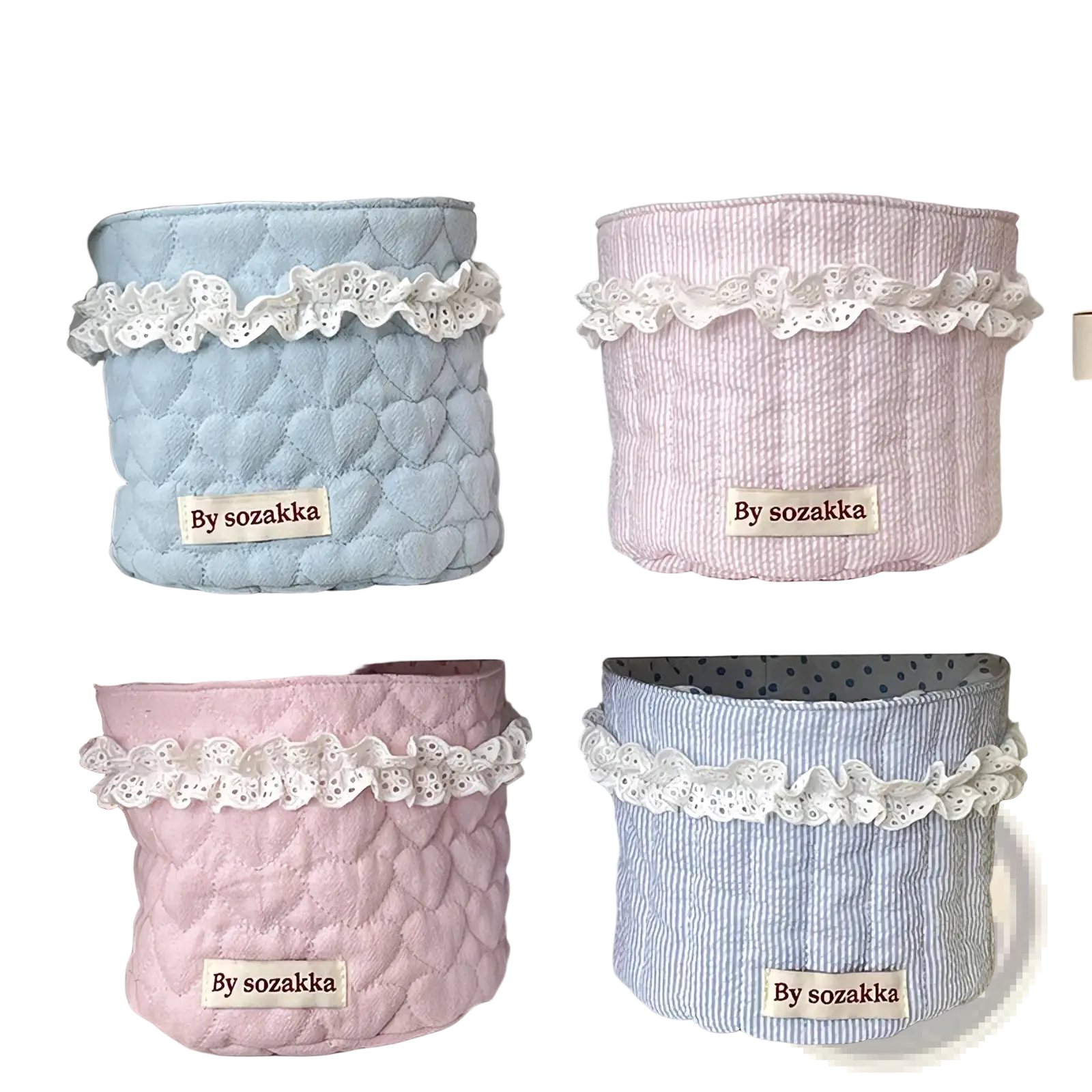Pastel-colored quilted nursery storage baskets with delicate white lace trim and heart-patterned stitching