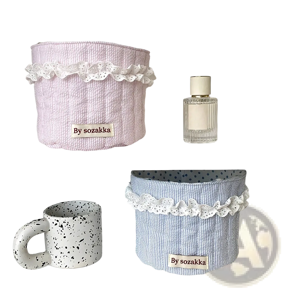 Quilted nursery storage baskets in pastel pink and blue stripes with white lace trim for organized storage