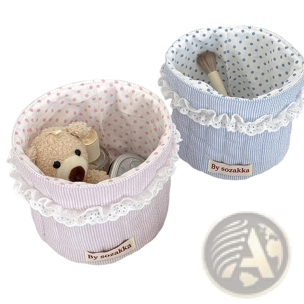 Quilted nursery storage basket in pink and white striped fabric with lace trim for organized baby rooms