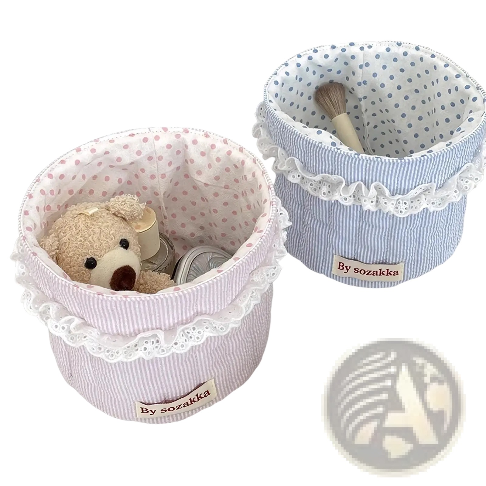 Quilted nursery storage basket in pink and white striped fabric with lace trim for organized baby rooms