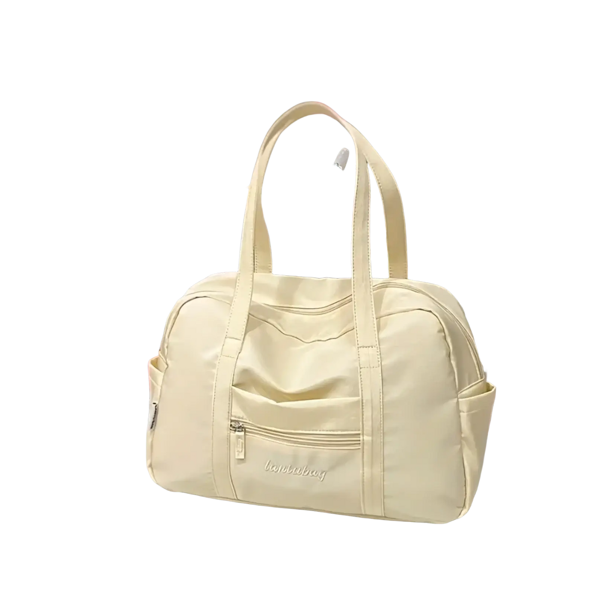Cream-colored quilted nylon travel tote bag with two top handles and front zippered pocket with plush charm