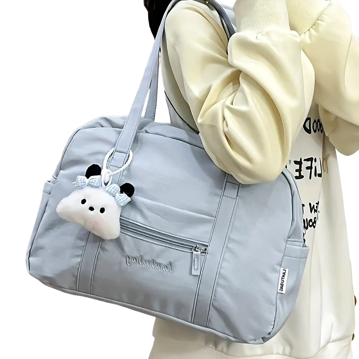 Light gray quilted nylon travel tote bag with durable material and a white plush cloud charm with black ears and bow