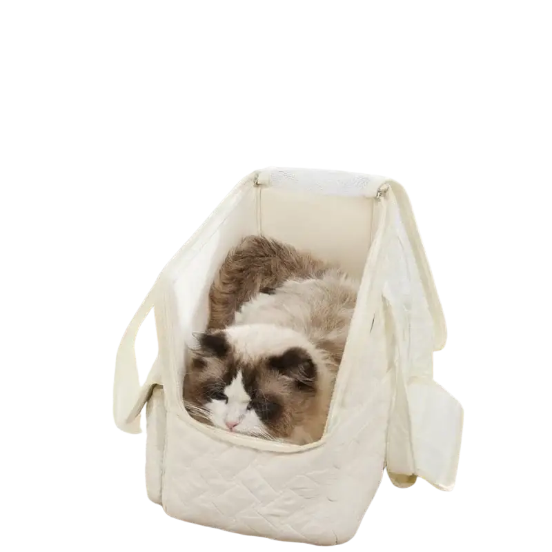 A cozy cream-colored quilted fabric pet carrier bag with soft padded interior and side flaps for small cats and dogs