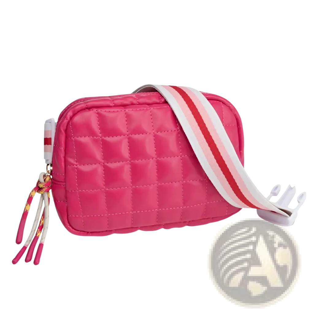 A vibrant pink quilted puffer crossbody bag with a striped strap and decorative tassels