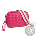 A vibrant pink quilted puffer crossbody bag with a striped strap and decorative tassels