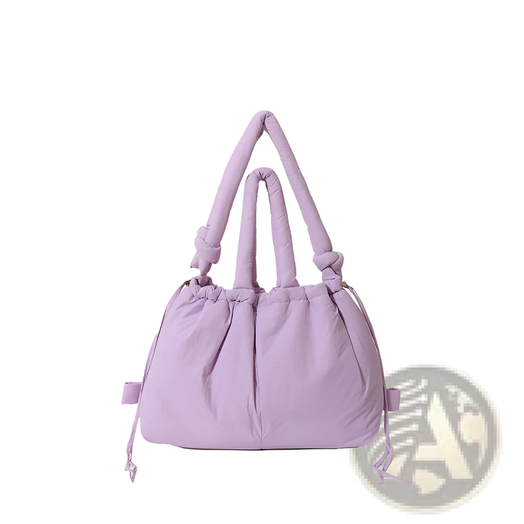 A soft lavender quilted puffer tote bag with knotted handles and drawstring side straps in lightweight nylon