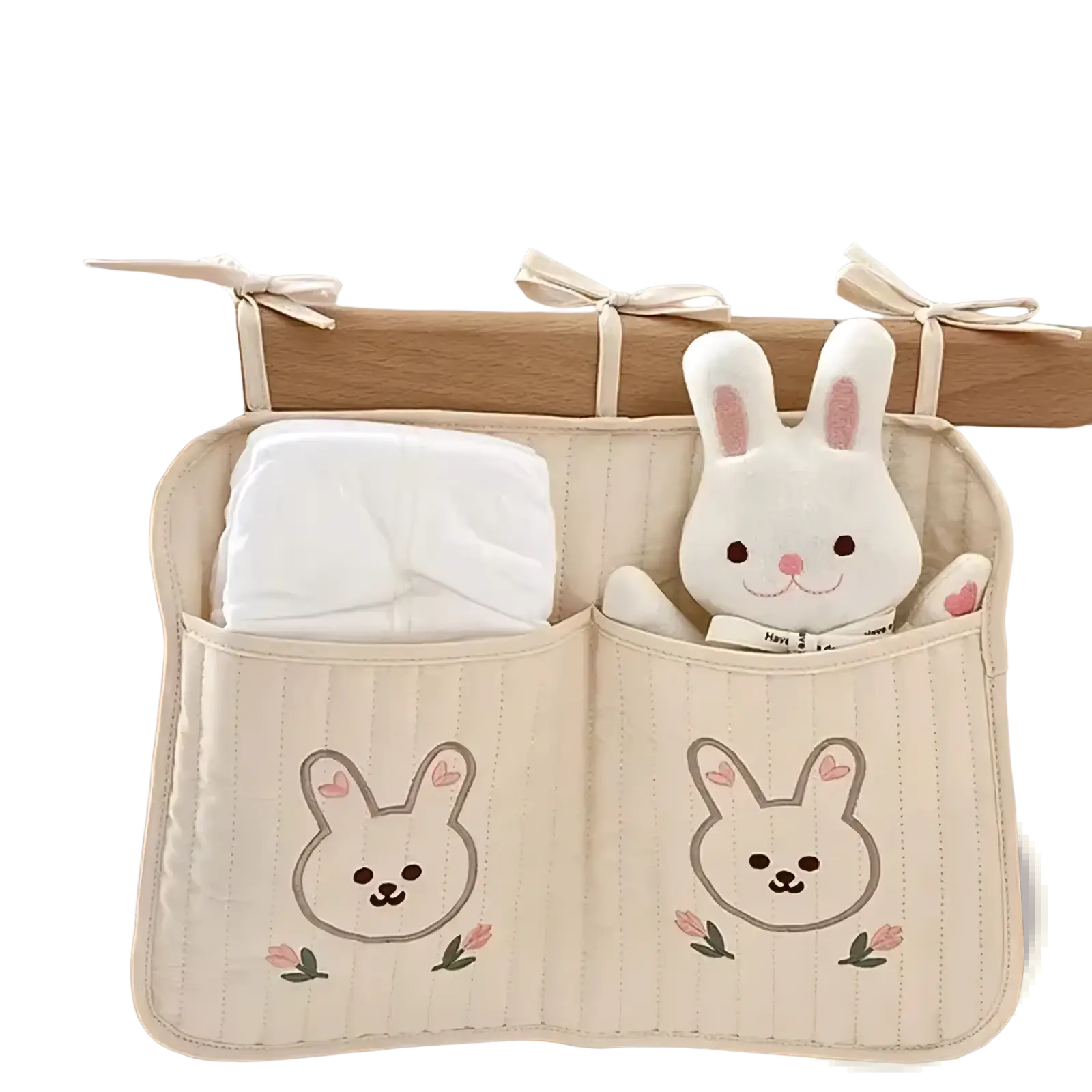 Cream-colored quilted stroller organizer bag with embroidered bunny faces and pink tulips featuring three hanging loops
