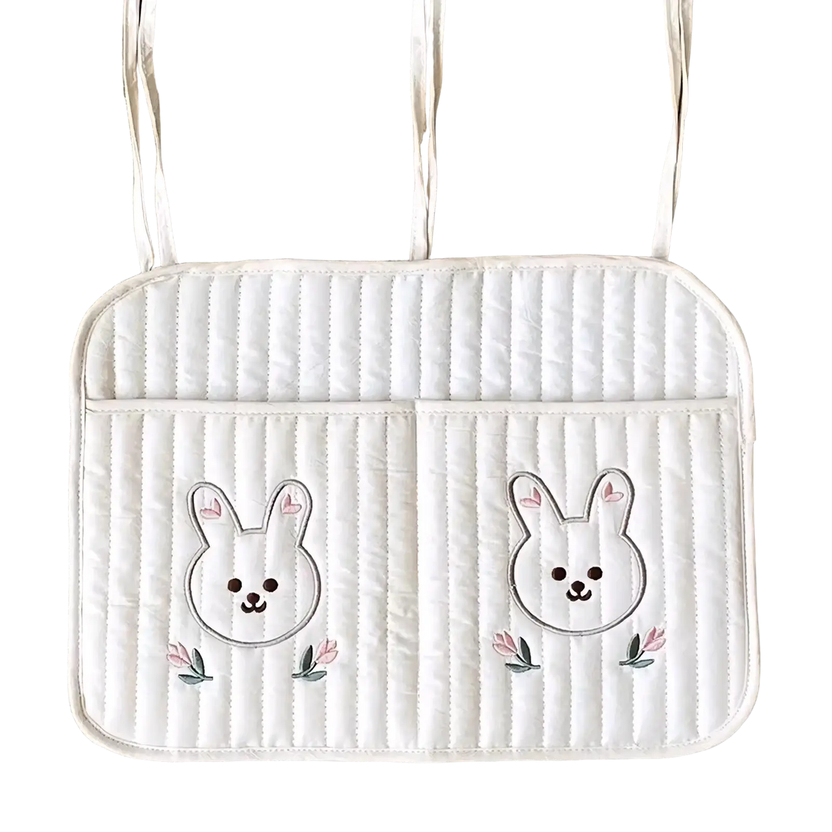 White quilted stroller organizer bag with embroidered bunny faces and pink flowers on car seat cushion