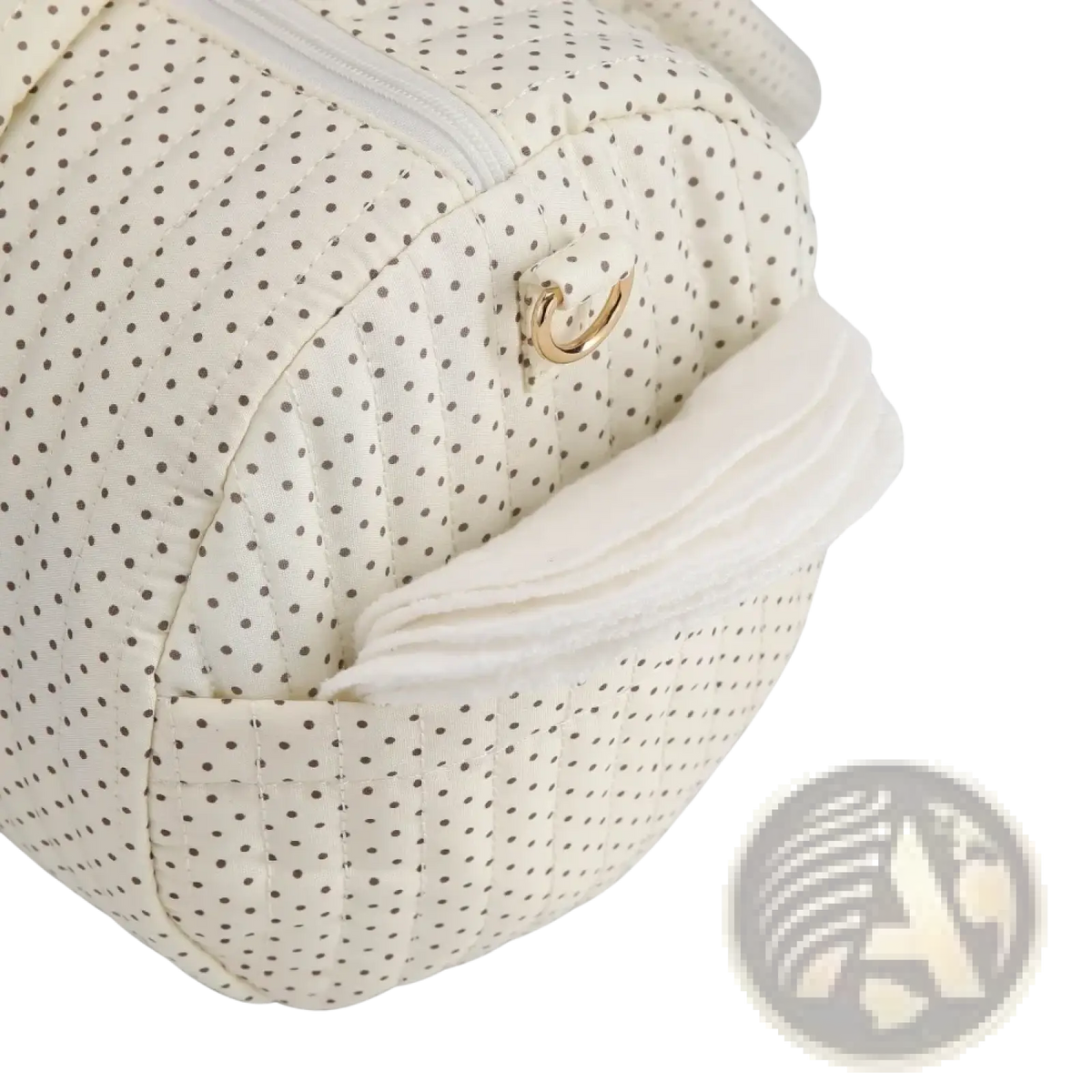 Cream-colored quilted stroller organizer bag with black polka dots and gold-tone metal clasp featuring teddy bear design