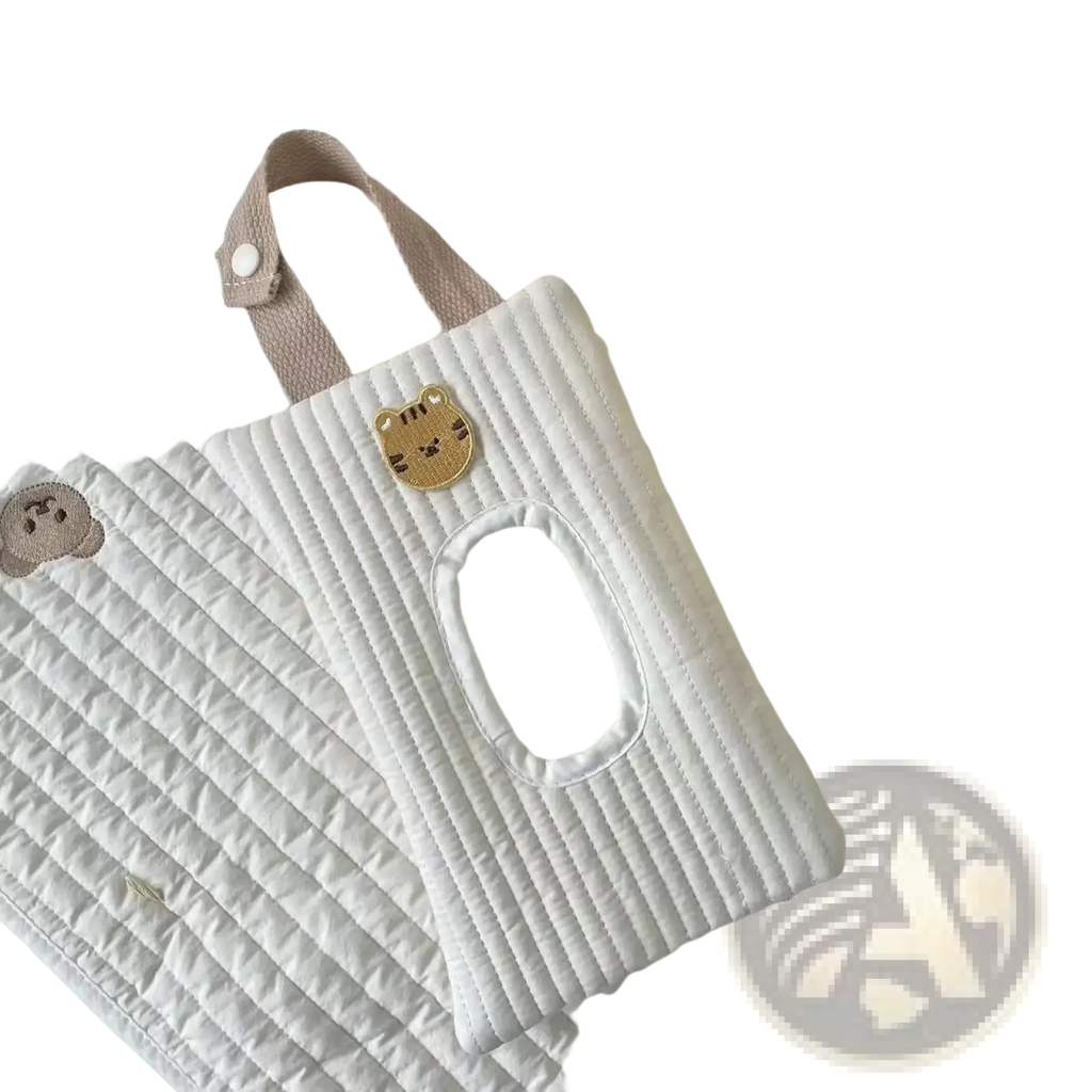 White quilted stroller tissue holder with beige strap and golden tiger face patch for wet wipes storage