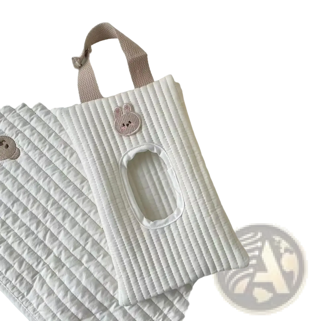 White quilted tissue holder with soft pink bunny appliqué and matching fabric strap for stroller use
