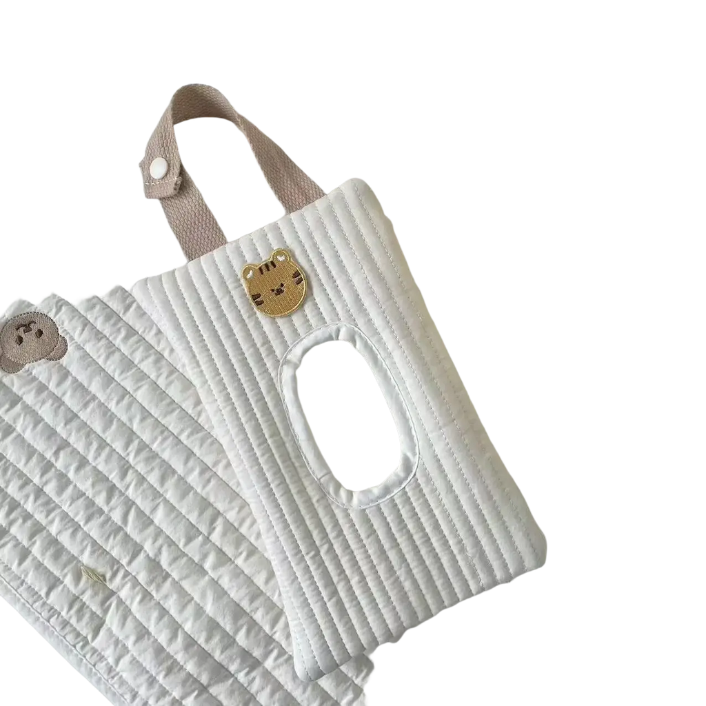 White quilted stroller tissue holder with beige strap and golden tiger face patch for wet wipes storage