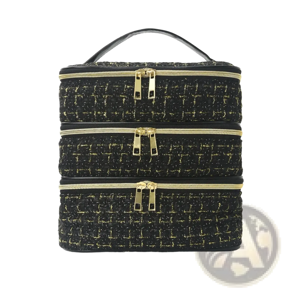 Black tweed three-compartment travel makeup organizer with gold-toned zippers and matching handle in a quilted design