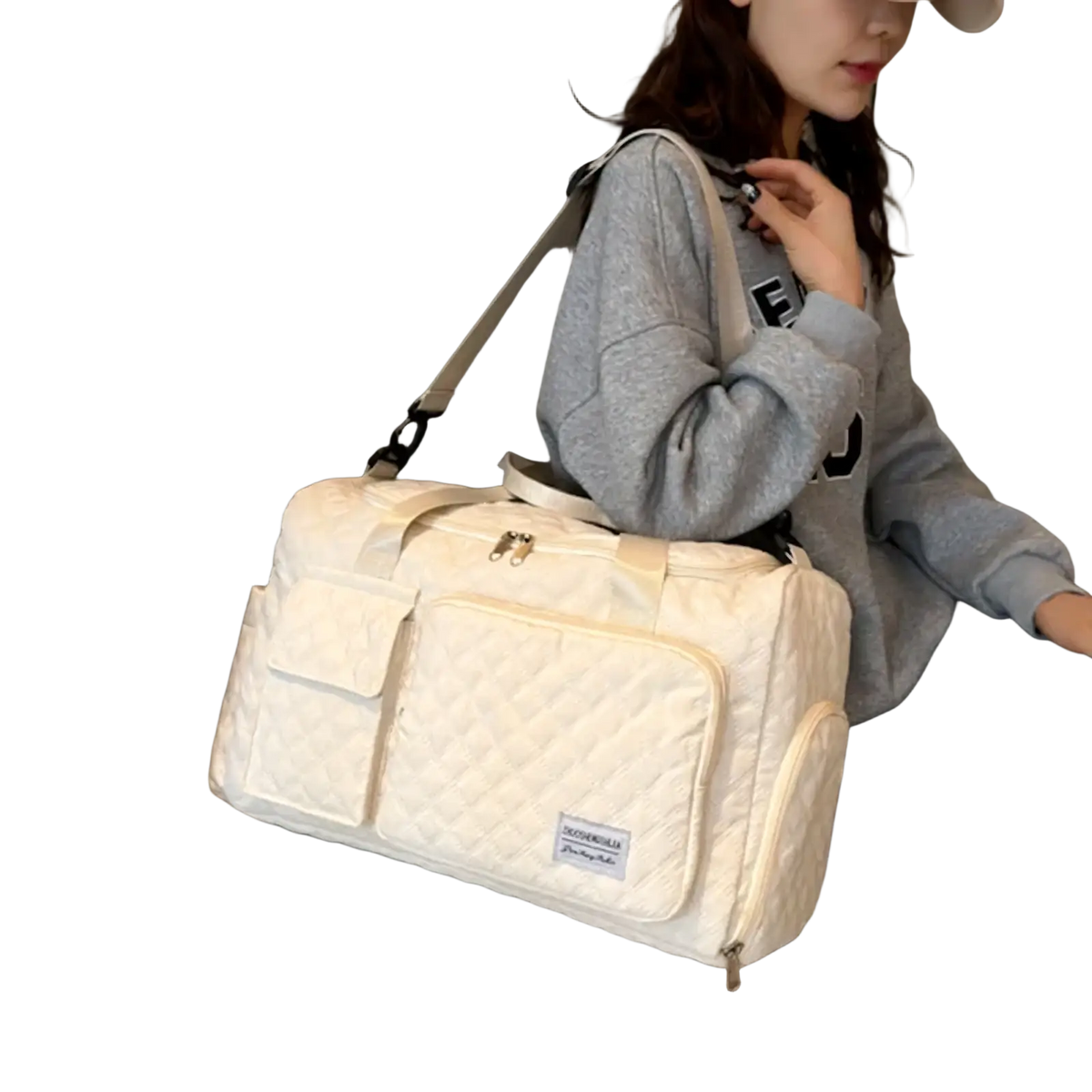 Cream-colored quilted large travel duffel bag with front pocket and adjustable shoulder strap waterproof tote